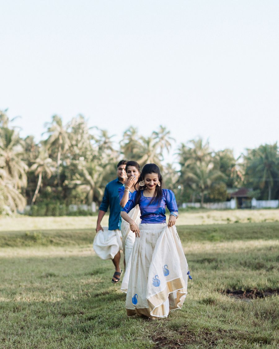 A couple in Kerala's lush estate grounds — a perfect setting for a private wedding