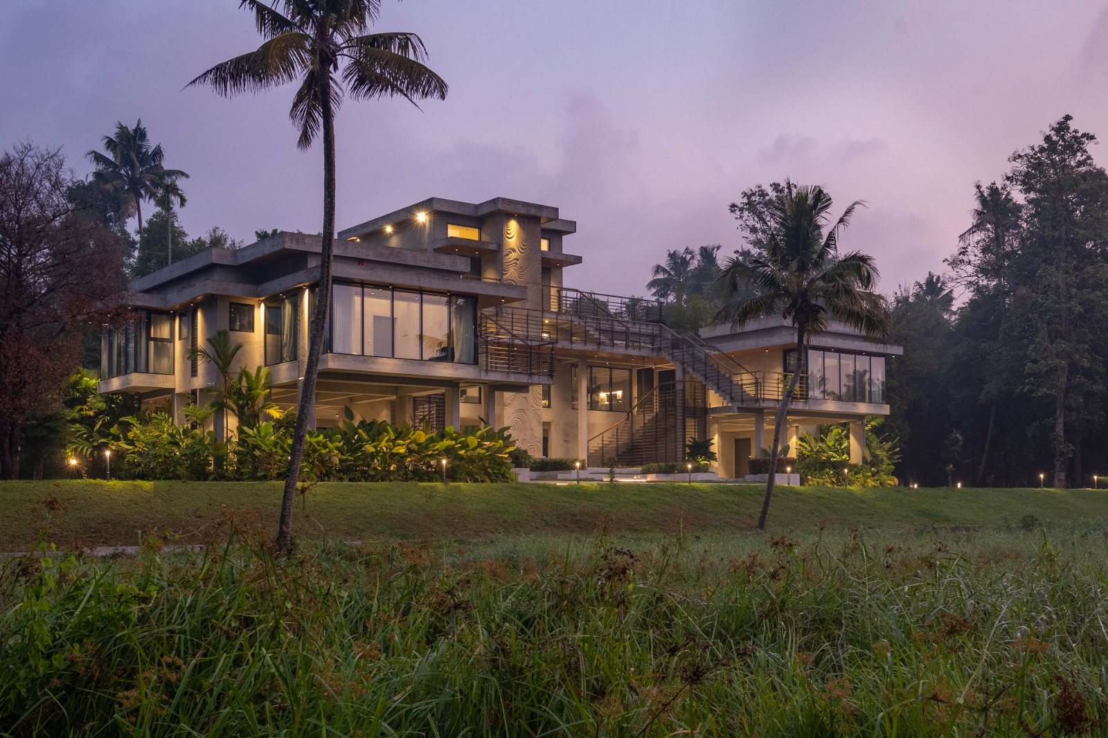 Sovnear estate facade under a violet dusk sky