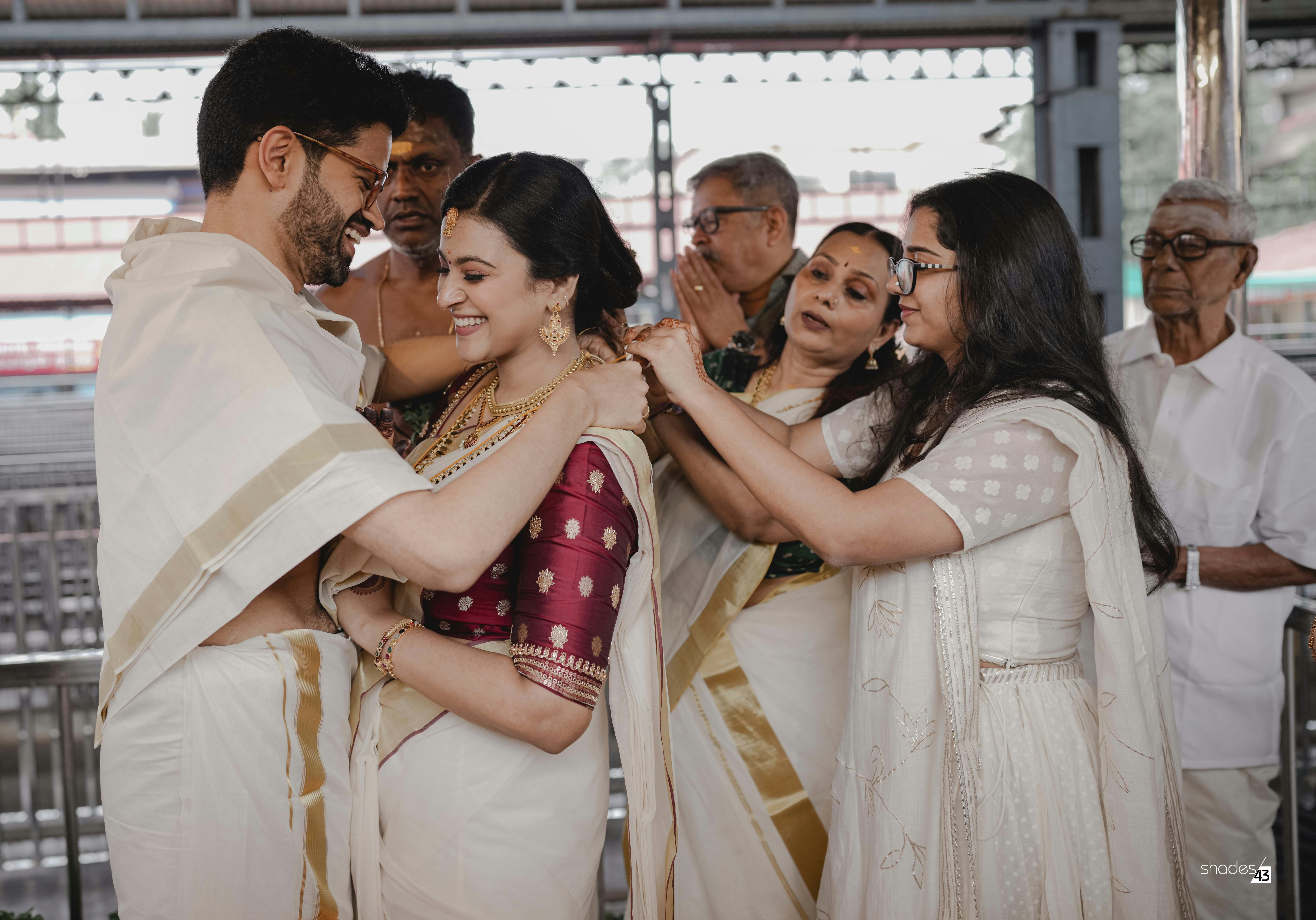 Kerala bride receiving blessings from family at the wedding ceremony