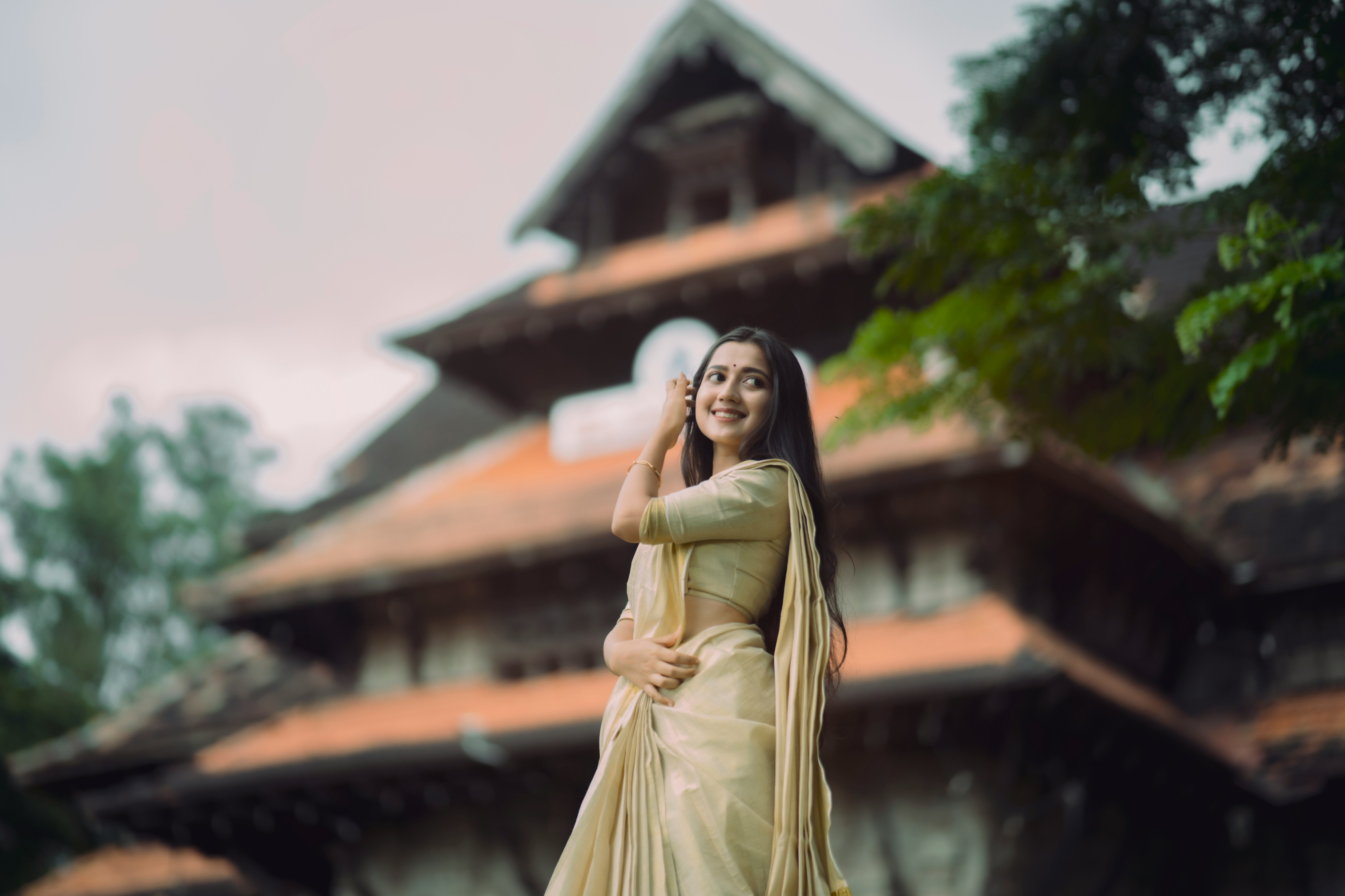 Kerala bride in gold kasavu saree at a traditional temple